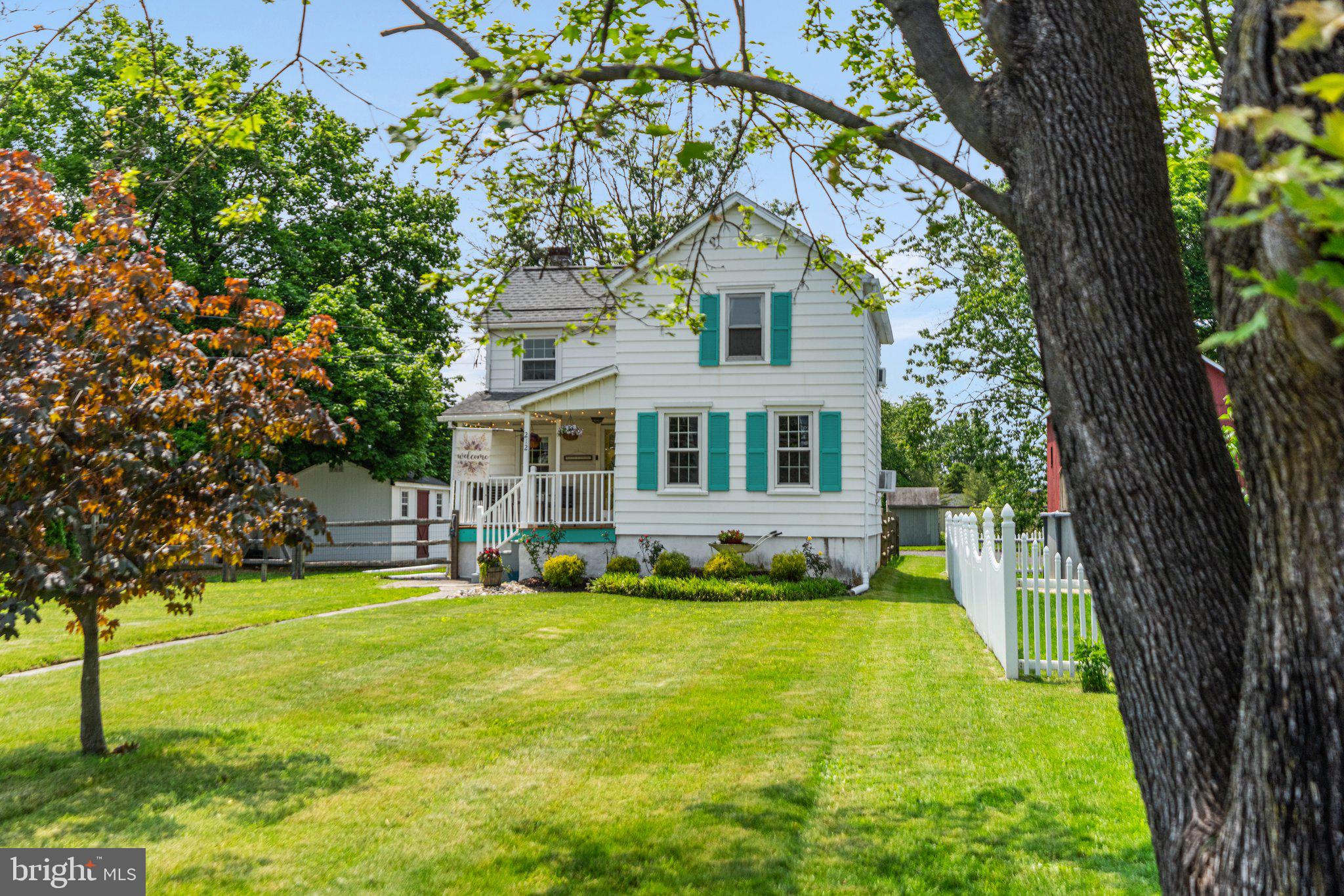 212 North Hellertown Avenue Quakertown, PA 18951 - Photo 1 of 40 a front view of a house with a yard